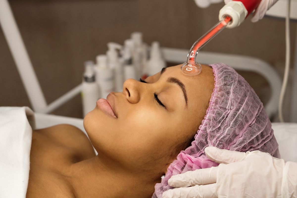a woman getting a power facial treatment in facial clinic In & Near Miami, FL 